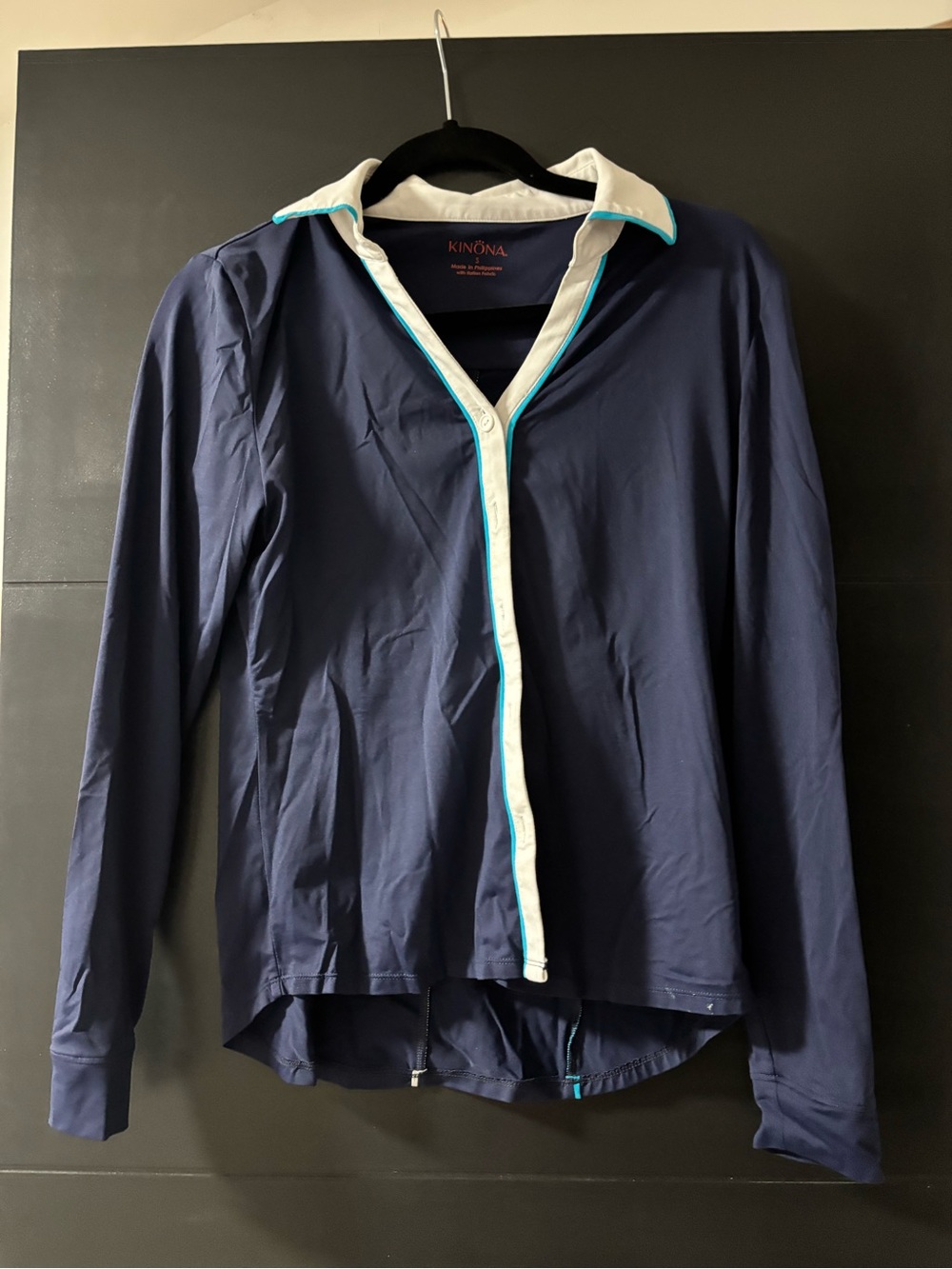Kinona Navy Top with White Trim and Coral Logo